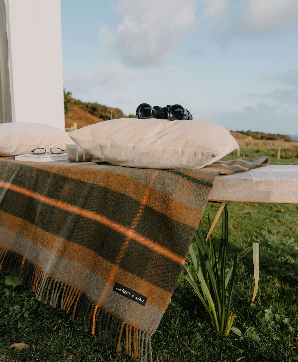 Sackcloth & Ashes Folk Olive camping blanket outdoors.
