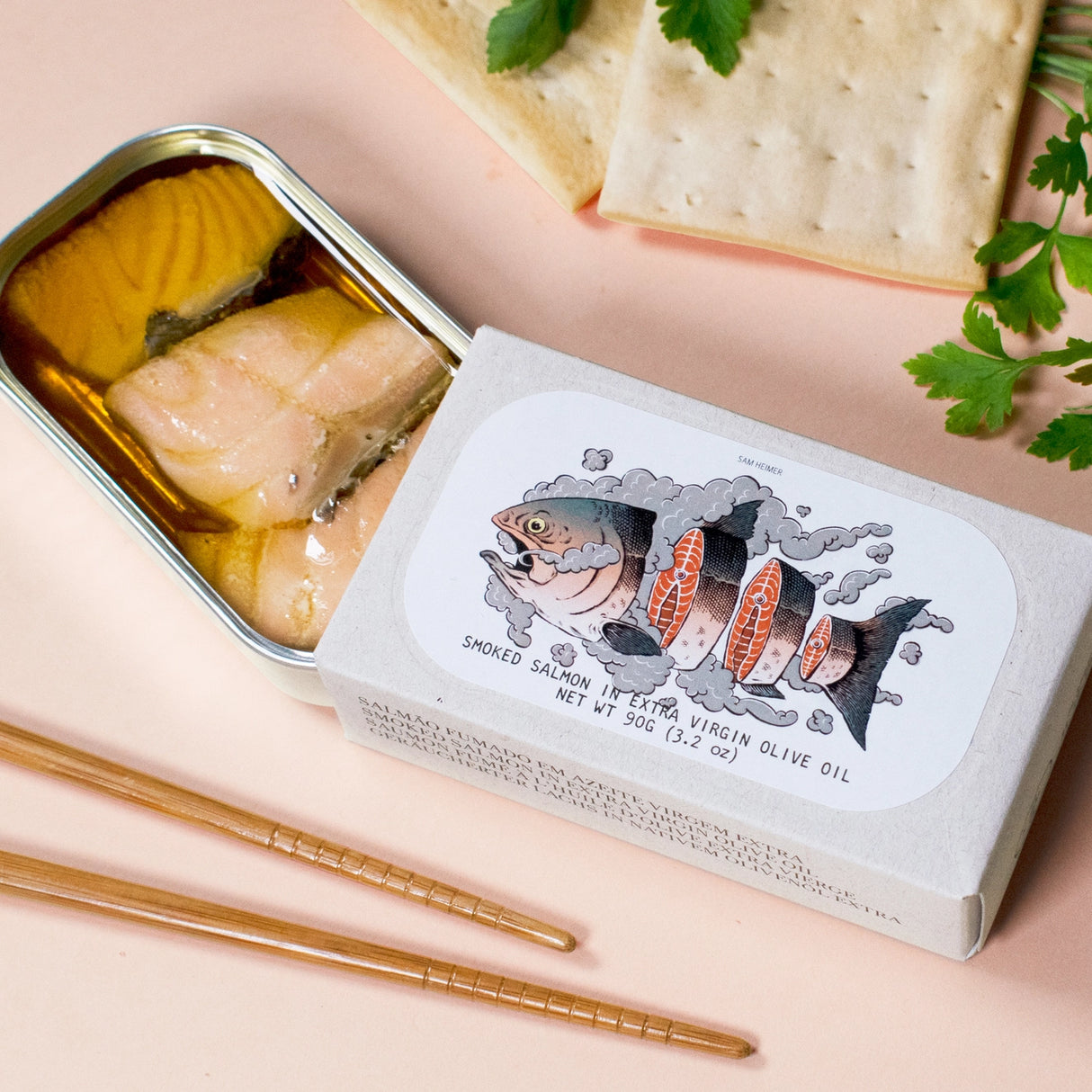 Jose Gourmet Smoked Salmon in Extra Virgin Olive Oil on a pink background