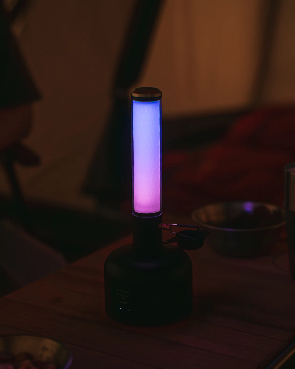 Snow Peak GigaPower Tabletop Lantern being used while camping and showing the color change mode.