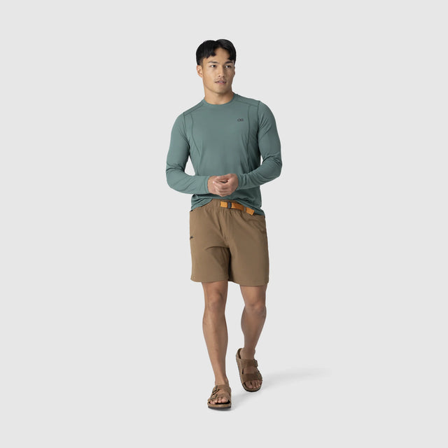 Man wearing an Outdoor Research Men's Echo Long Sleeve Tee in Malachite on a white background