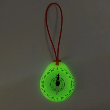 Brunton Tag-Along 9041 Glow Compass features a glow in the dark design and orange cord lanyard.
