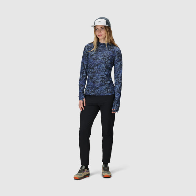 Woman wearing an Outdoor Research Women's Echo Hoodie in Fjord Granite Print on a white background