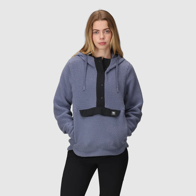 Woman wearing an Outdoor Research Women's Grayland Fleece Pullover Hoodie on a white background