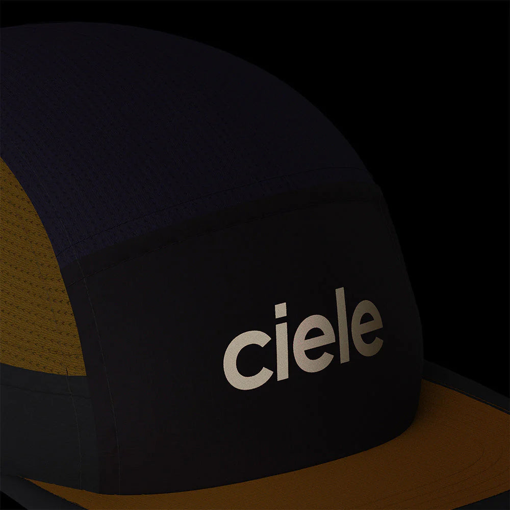 View of the Ciele ALZCap at night, showcasing the reflective Ciele logo on the front.