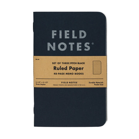 Field Notes Pitch Black Memo Book pocket journal with Ruled Paper on a neutral background.