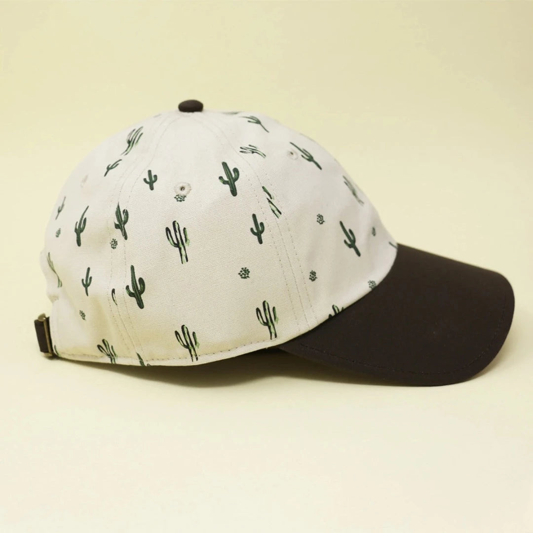 Stylish, neutral colored hat printed with small, green cacti made from sustainable materials, showcasing eco-friendly fashion.