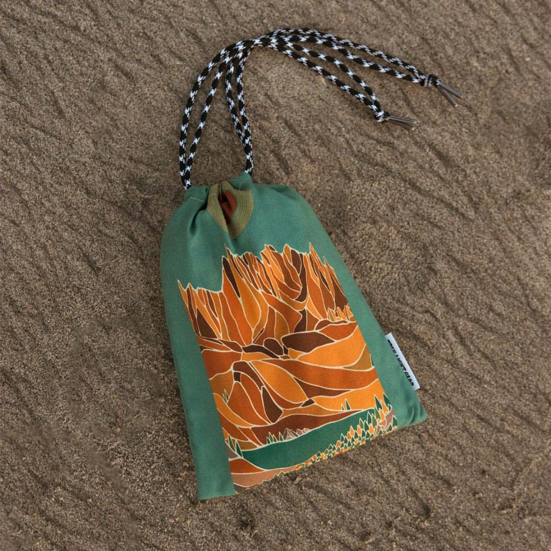 Trek Light Alpenglow Wander towel is made from recycled plastic bottles and features bag for carrying the towel.