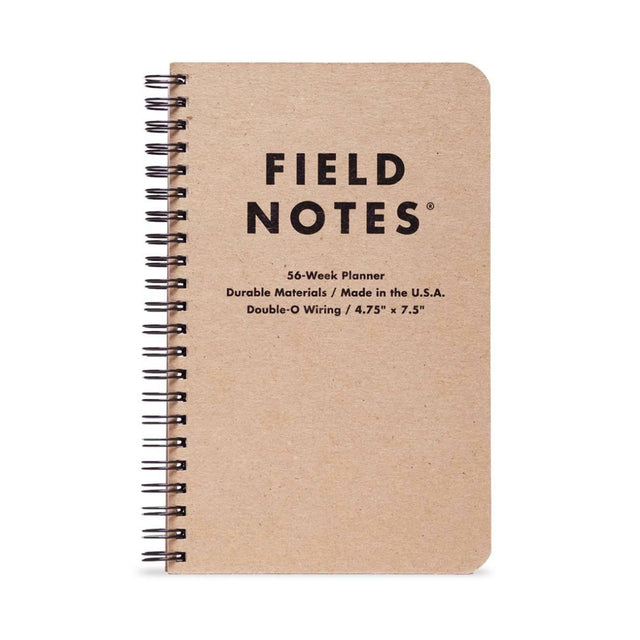 Field Notes 56-Week Planner pocket planner on a neutral background.