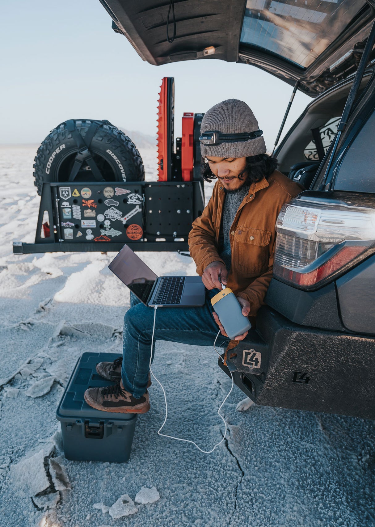 BioLite Charge 80 PD being used outdoors to charge a laptop.