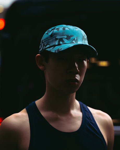Ciele Athletics GOCap SC Field Loopy MU running hat in Dusty Turquoise worn by a runner outdoors.