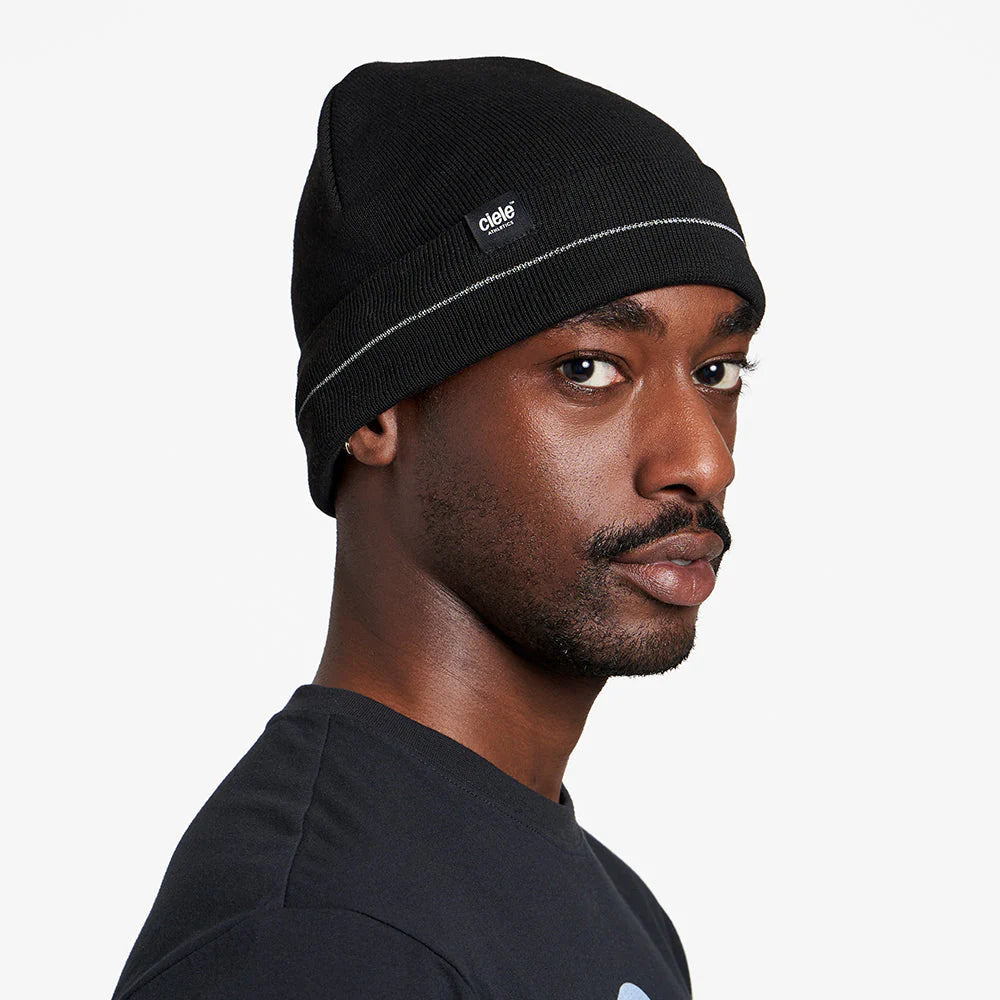 Ciele Athletics CR3Beanie trail running beanie in Shadowcast worn by a man from the side on a neutral background.