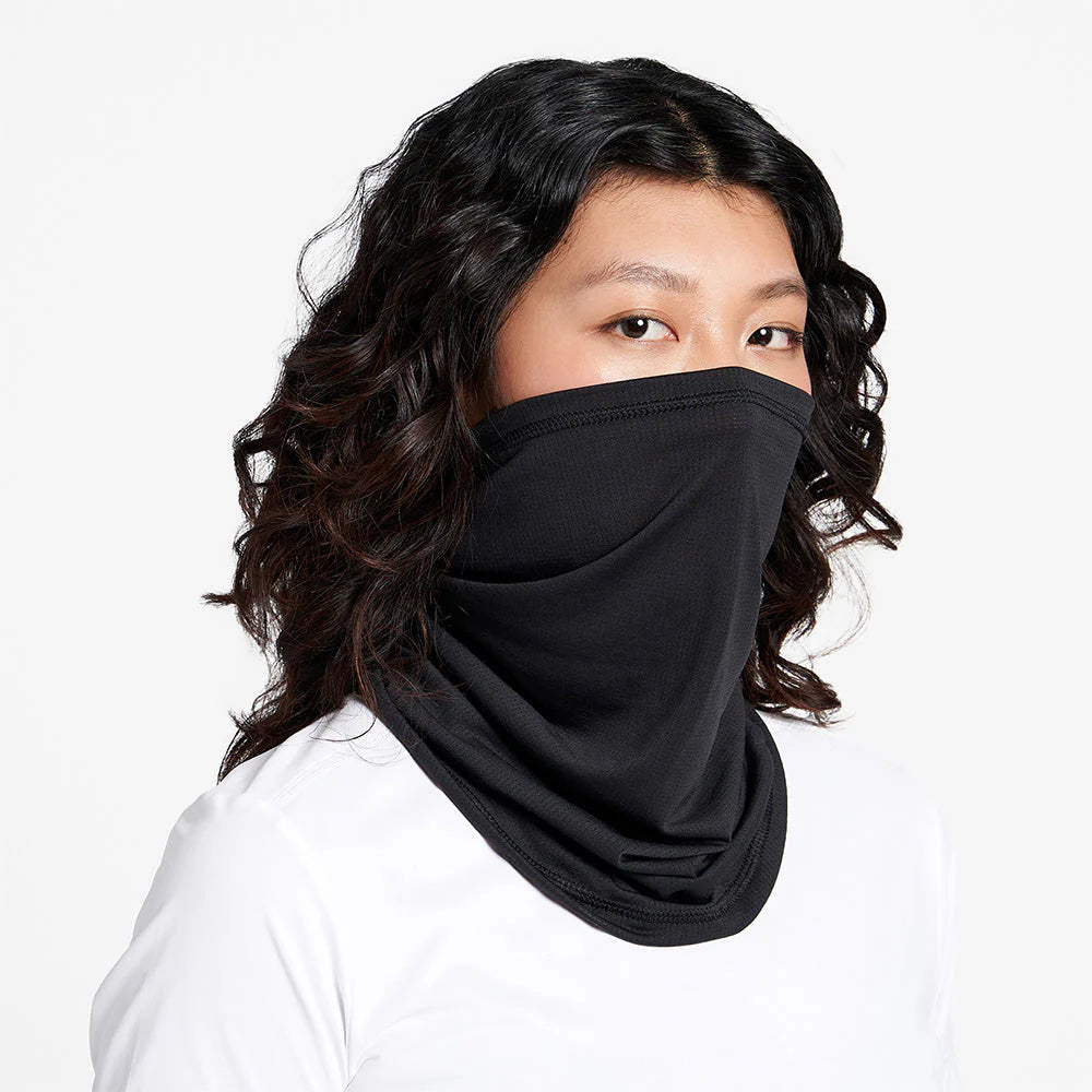 Ciele Athletics FSTCollar neck gaiter in Shadowcast worn by a woman on a neutral background.