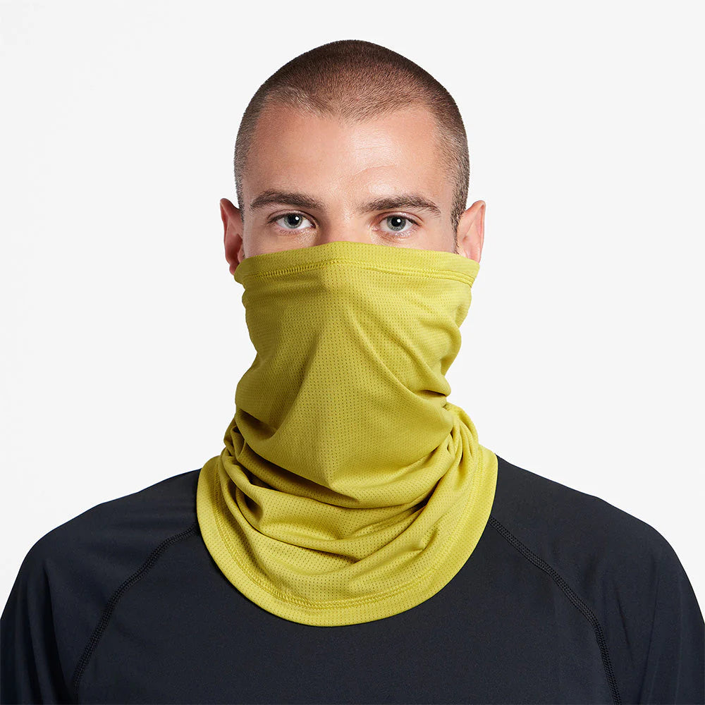 Ciele Athletics FSTCollar neck gaiter in Sogl worn by a man on a neutral background.