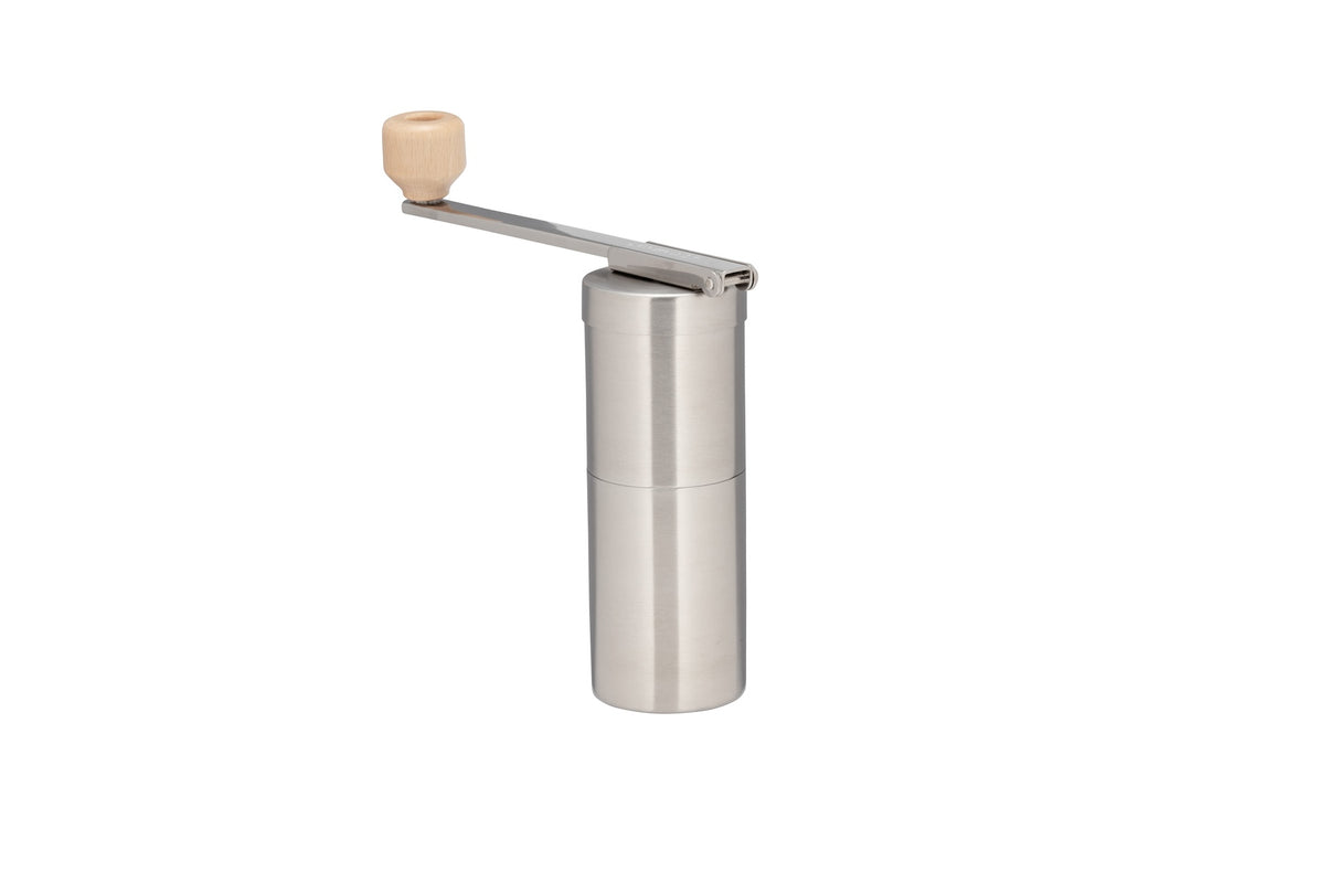 Snow Peak Field Barista Coffee Grinder for camping on a neutral background.