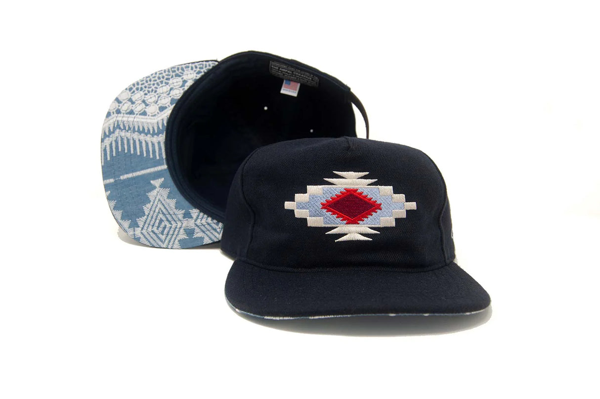 Blue Ampal Creative Chimayo Strapback Hat with geometric design on a white background