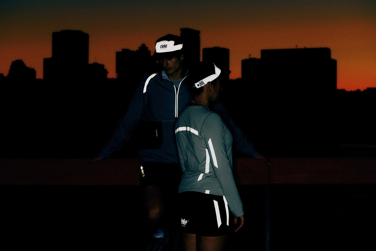 Ciele Athletics GOCap - Nite Rite in Shadowcast worn by runners at nighttime.