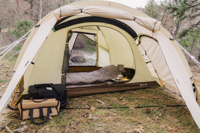 Snow Peak LiteMax Titanium Stove on a camping background.