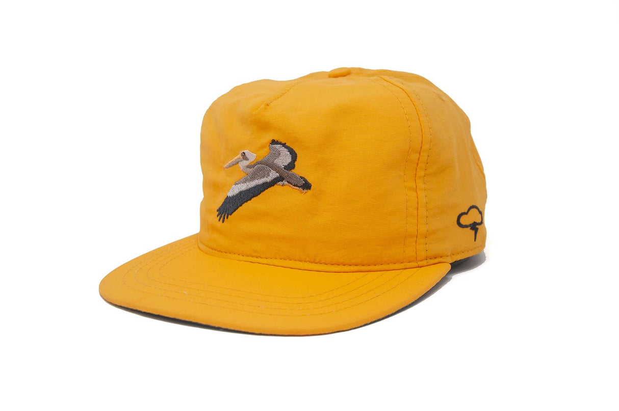Yellow Ampal Creative Glider Gold Strapback Hat with a bird design on a white background