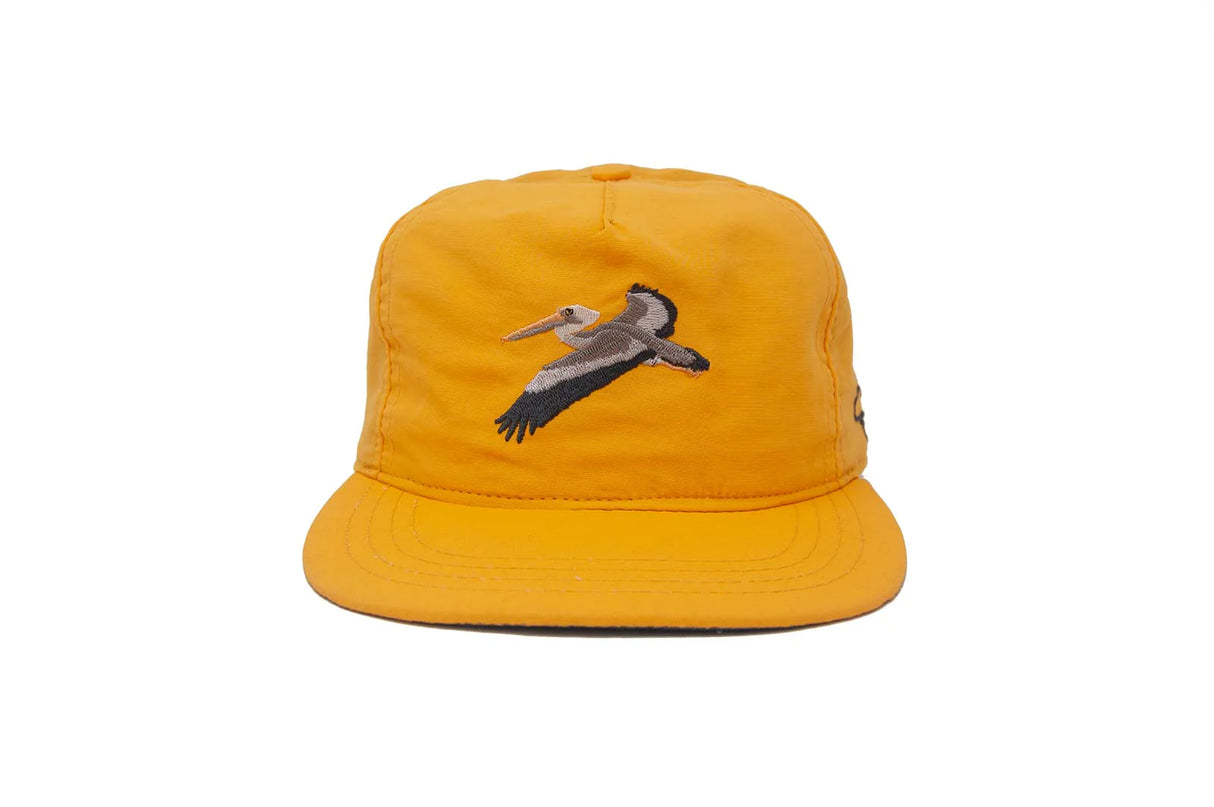 Yellow Ampal Creative Glider Gold Strapback Hat with a bird design on a white background