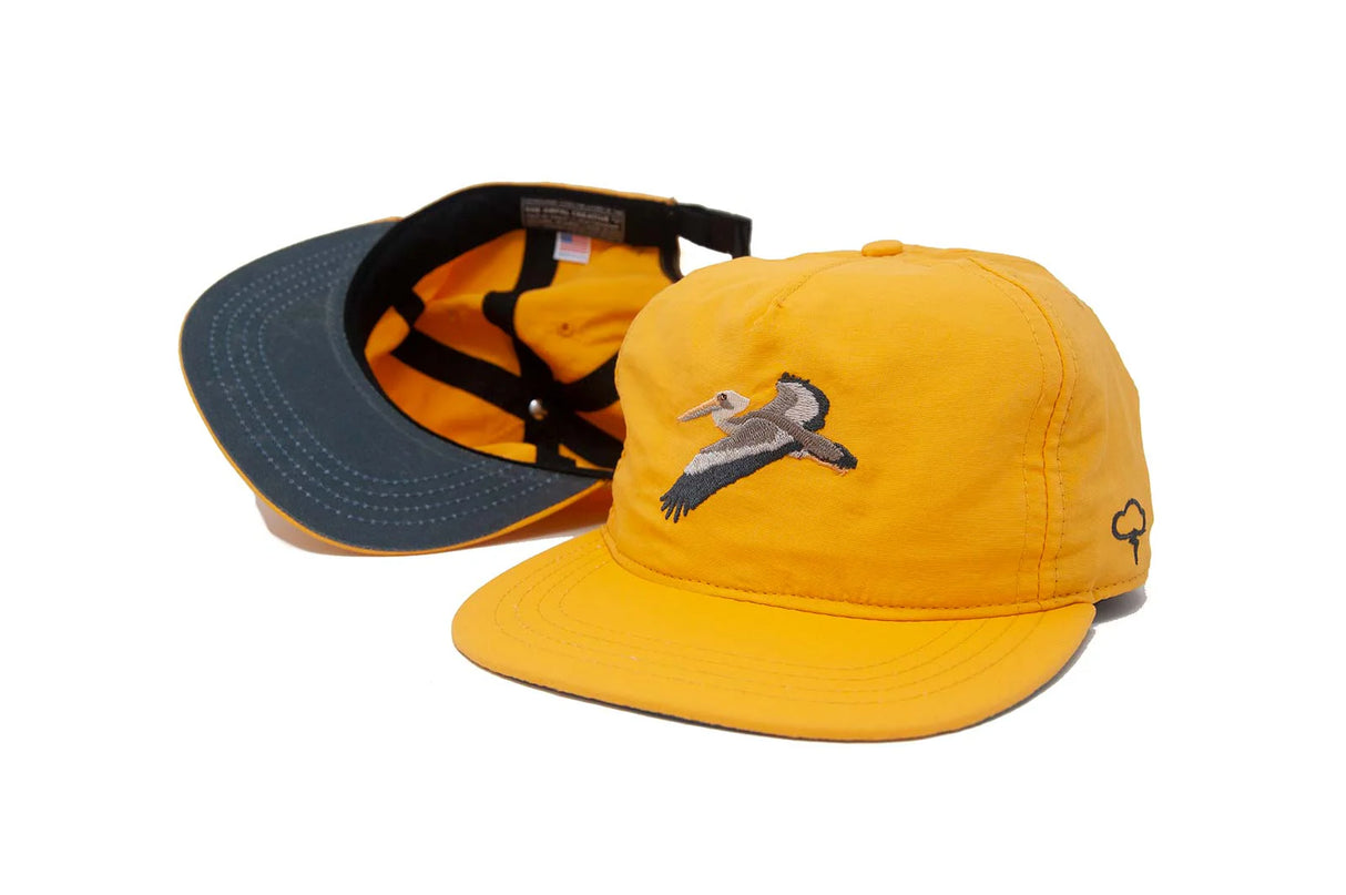 Yellow Ampal Creative Glider Gold Strapback Hat with a logo on a white background