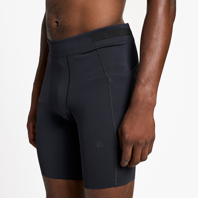 Ciele Athletics M FSTTight Short 8" men's running half tight in Shadowcast worn by a runner on a neutral background.