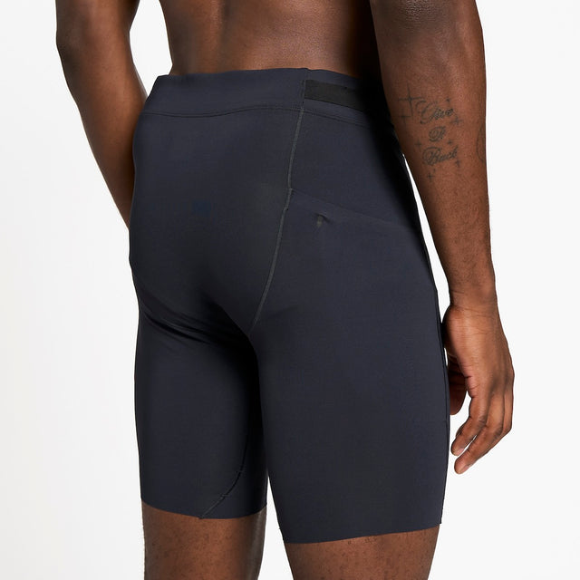 Ciele Athletics M FSTTight Short 8" men's running half tight in Shadowcast worn by a runner on a neutral background.