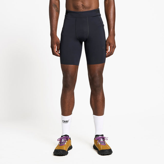 Ciele Athletics M FSTTight Short 8" men's running half tight in Shadowcast worn by a runner on a neutral background.