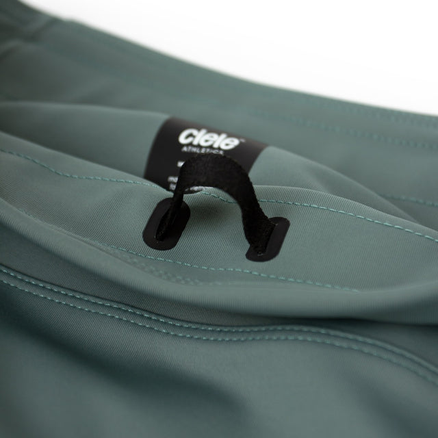 Ciele Athletics M FSTTight Short 8" men's running half tight in Silver Pine on a neutral background.