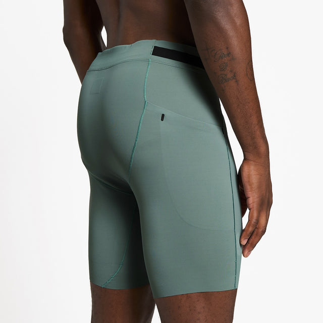 Ciele Athletics M FSTTight Short 8" men's running half tight in Silver Pine worn by a runner on a neutral background.