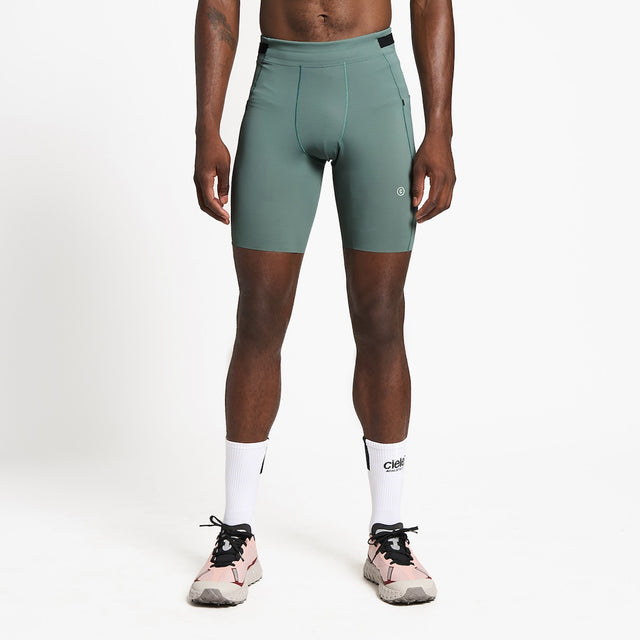 Ciele Athletics M FSTTight Short 8" men's running half tight in Silver Pine worn by a runner on a neutral background.