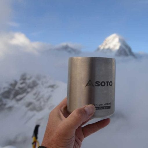 SOTO Aero Mug 450 ml titanium camp mug on a snowy background.