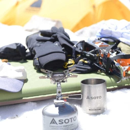 SOTO Aero Mug 450 ml titanium camp mug on a camp background.