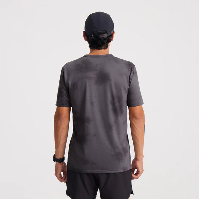 Person wearing a Roark Mathis Active Tie Dye Pocket Short Sleeve Tee in Gray and black cap from behind on a white background