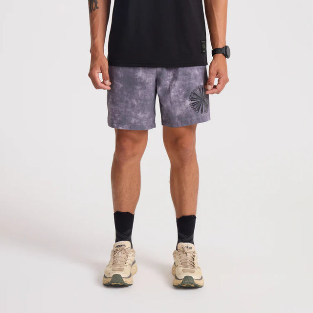Person wearing Roark Serrano 7" Active Stretch Shorts in Shark with a black top on a light gray background