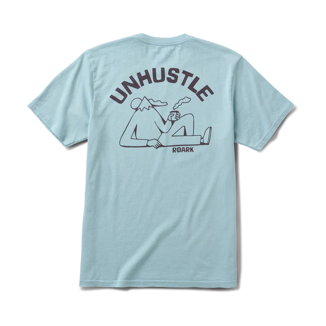 Light blue Roark Unhustle Premium Tee with 'Unhustle' graphic on the back against a white background