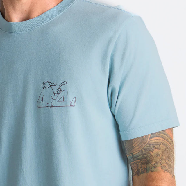 Light blue Roark Unhustle Premium Tee with a small graphic on a plain background