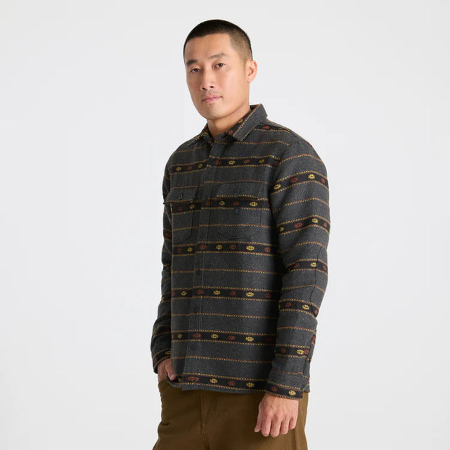 Man wearing a Roark Men's Nordsman Long Sleeve Flannel in Onyx on a white background