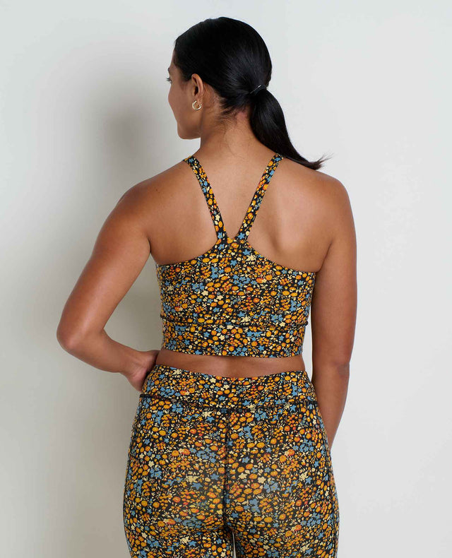 Toad&Co Terrane Longline Bralette sports bra in Black Ditsy Print on a neutral background.