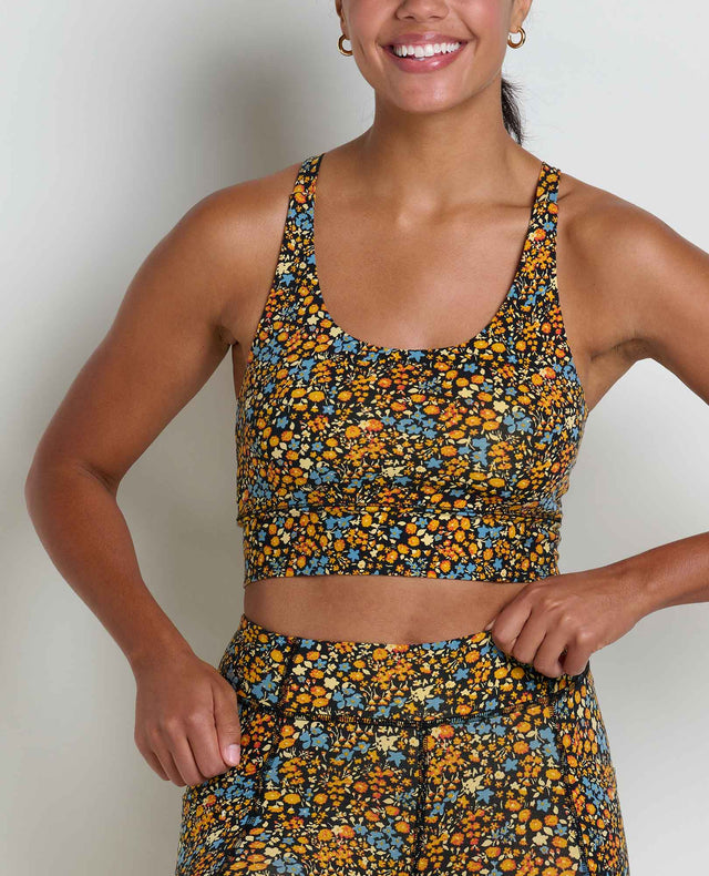 Toad&Co Terrane Longline Bralette sports bra in Black Ditsy Print on a neutral background.