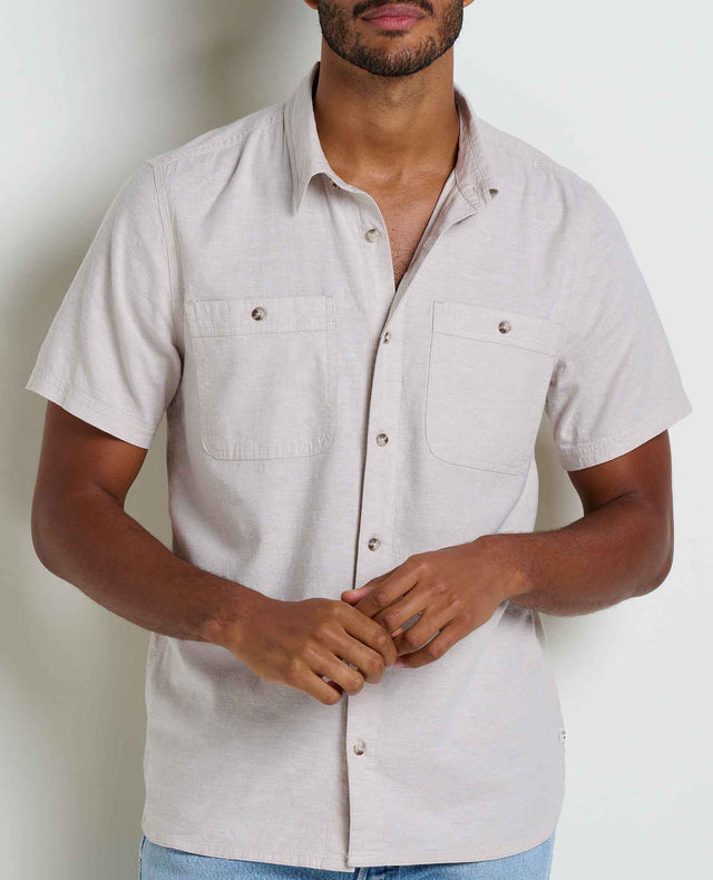 Toad&Co Men's Taj Hemp Short Sleeve Shirt in Oatmeal worn by a man.