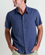 Toad&Co Men's Taj Hemp Short Sleeve Shirt in True Navy worn by a man.