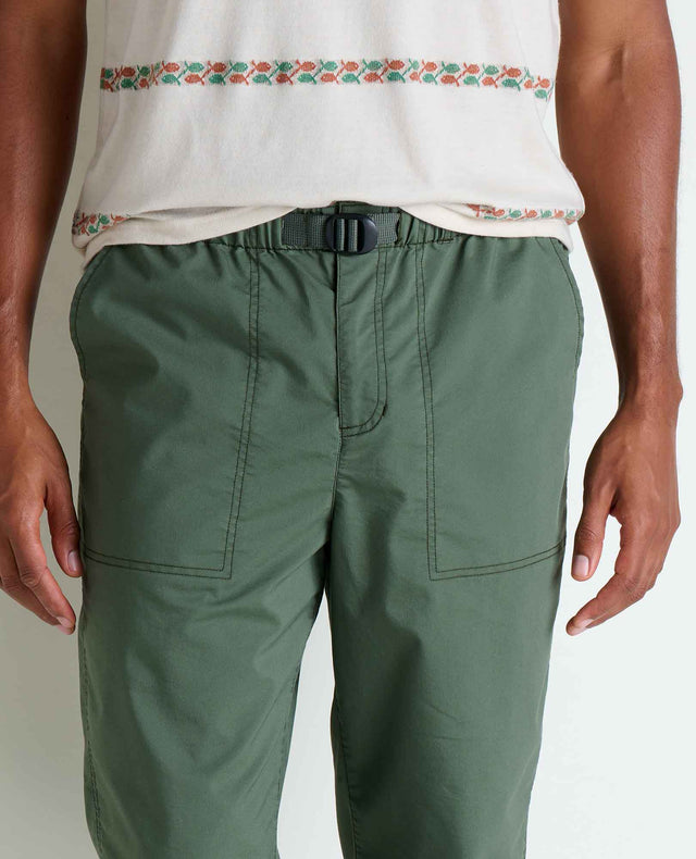 Toad&Co Men's Boundless Jogger in Beetle worn by a runner outdoors.