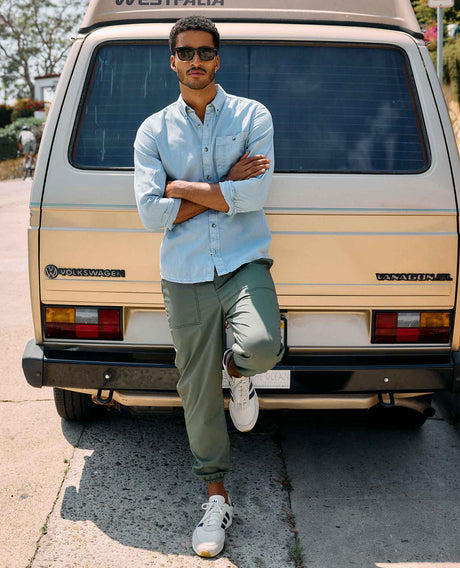 Toad&Co Men's Boundless Jogger in Beetle worn by a runner outdoors.