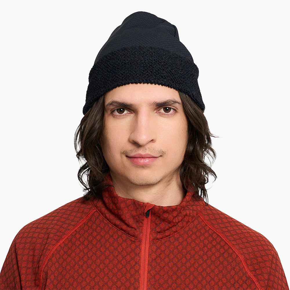 Person wearing a ciele UHBeanie fleece running beanie in Shadowcast on a white background