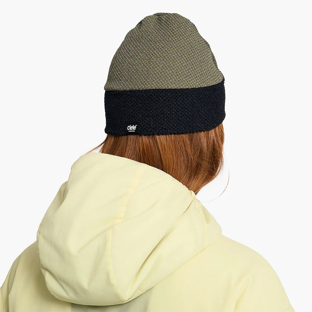 Person wearing a ciele UHBeanie fleece running beanie in Canvas on a white background