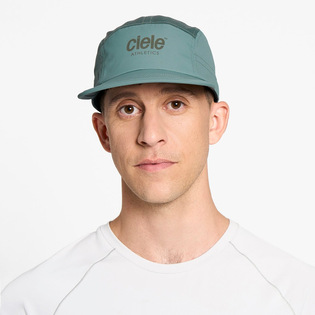 Ciele Athletics GOCap Classic Athletics running hat in Silver Pine worn by a man on a neutral background.