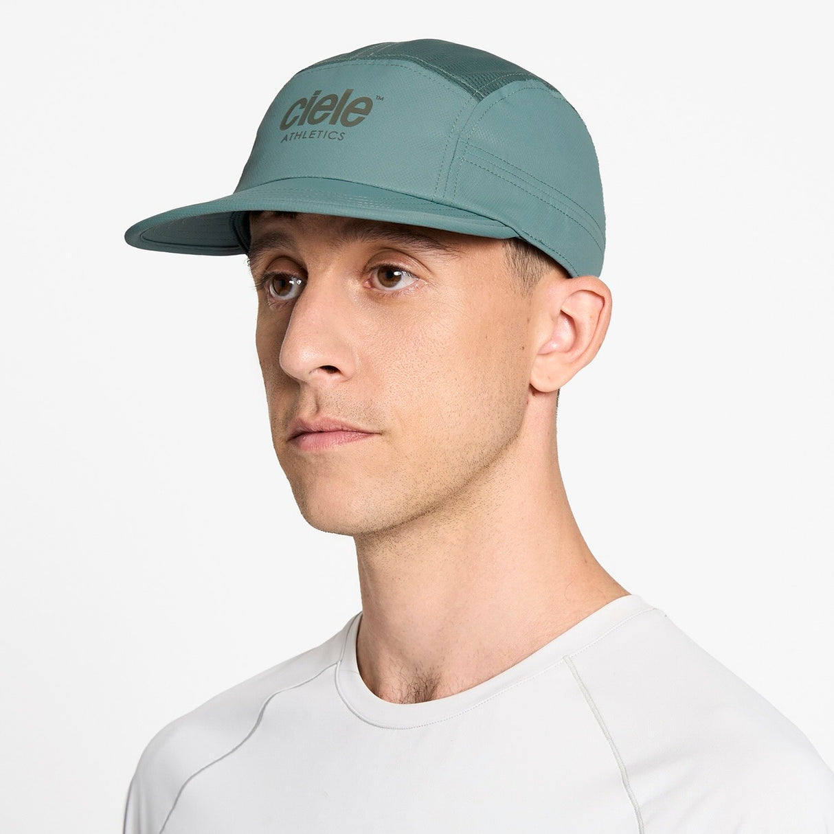 Ciele Athletics GOCap Classic Athletics running hat in Silver Pine worn by a man on a neutral background.