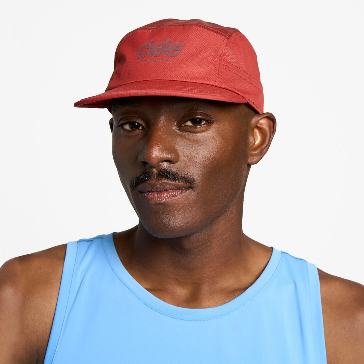 Ciele Athletics GOCap Classic Athletics running hat in Clay worn by a man on a neutral background.