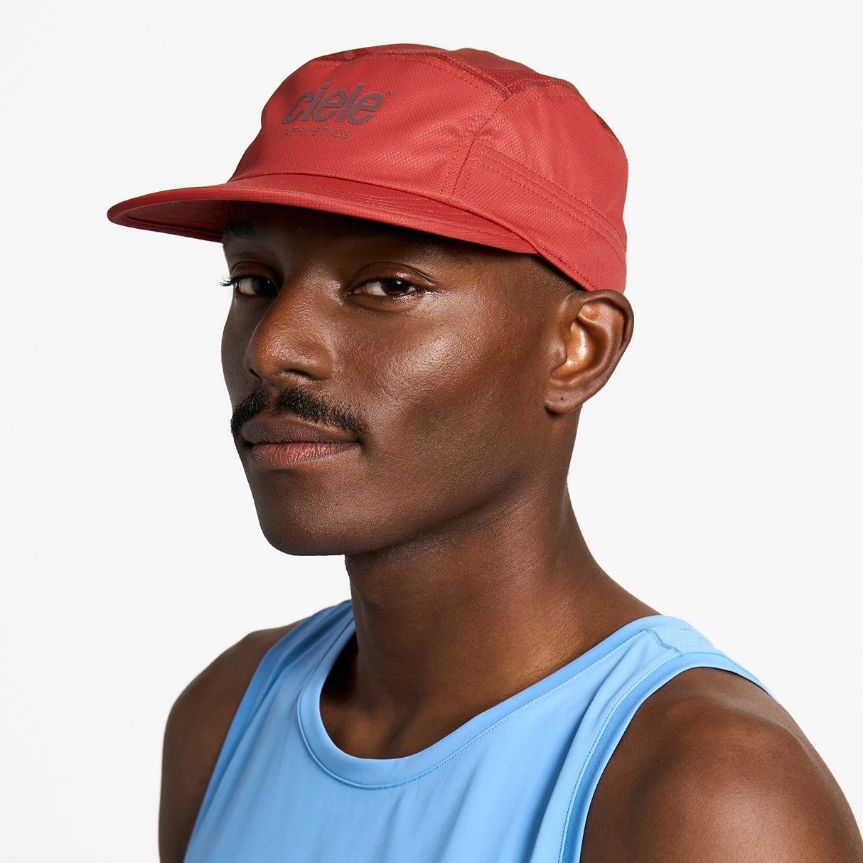 Ciele Athletics GOCap Classic Athletics running hat in Clay worn by a man on a neutral background.