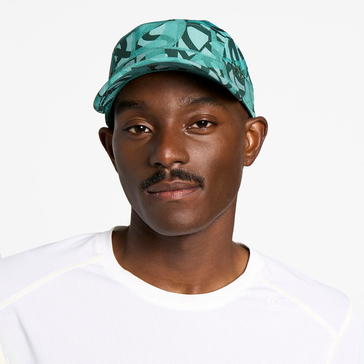Ciele Athletics GOCap SC Field Loopy MU running hat in Dusty Turquoise worn by a man on a neutral background.